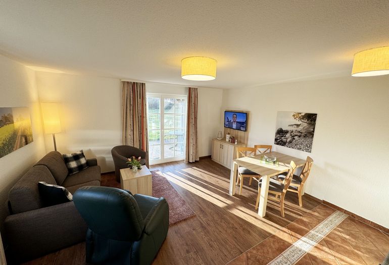 Haus an der Düne WE 06 Flachbildschirm im Wohnzimmer