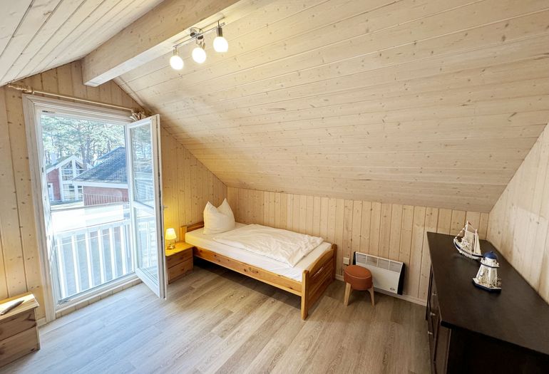 Ferienhaus Sprottenkiste - hell und freundliches Schlafzimmer im Dachgeschoss Ferienhaus Sprottenkiste - hell und freundliches Schlafzimmer im Dachgeschoss