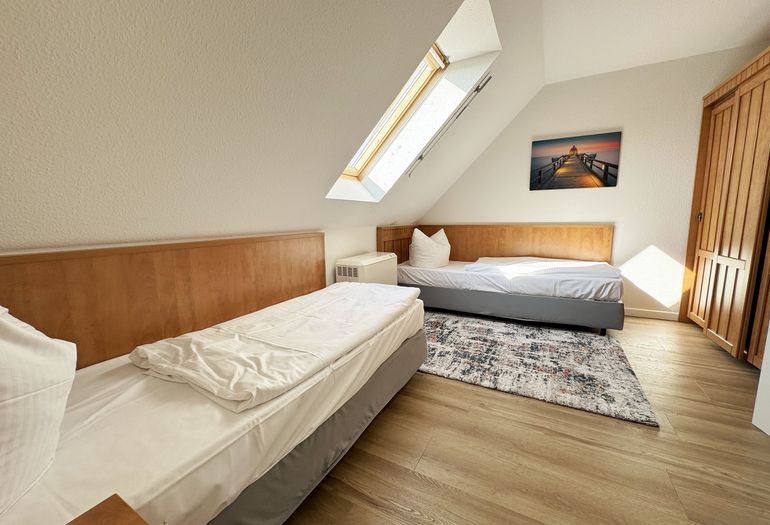 2. Schlafzimmer mit Einzelbetten der Ferienwohnung 2. Schlafzimmer mit Einzelbetten der Ferienwohnung