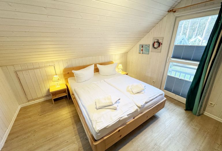 Ferienhaus Sandkörnchen - 2. Schlafzimmer im Obergeschoss Ferienhaus Sandkörnchen - 2. Schlafzimmer im Obergeschoss