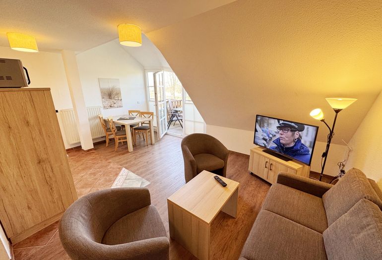 gemütlicher Wohnbereich mit Flachbild- TV gemütlicher Wohnbereich mit Flachbild- TV