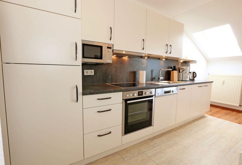 Küchenzeile für ein gemeinsames Kochen in der Familie Küchenzeile für ein gemeinsames Kochen in der Familie