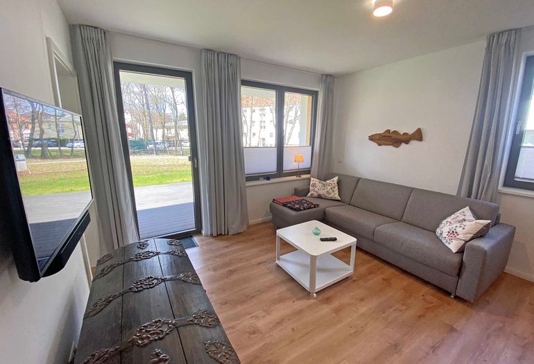 Wohnzimmer mit Couch für gemeinsame Abende Wohnzimmer mit Couch für gemeinsame Abende