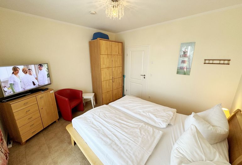 Schlafzimmer mit Sitzmöglichkeit