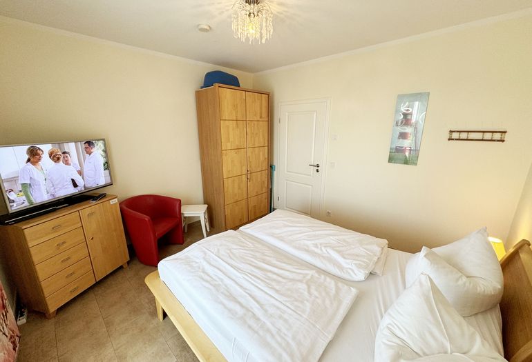 Schlafzimmer mit Sitzmöglichkeit