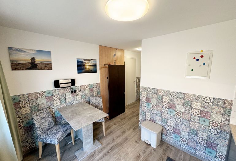 Essbereich mit angrenzender Garderobe Essbereich mit angrenzender Garderobe