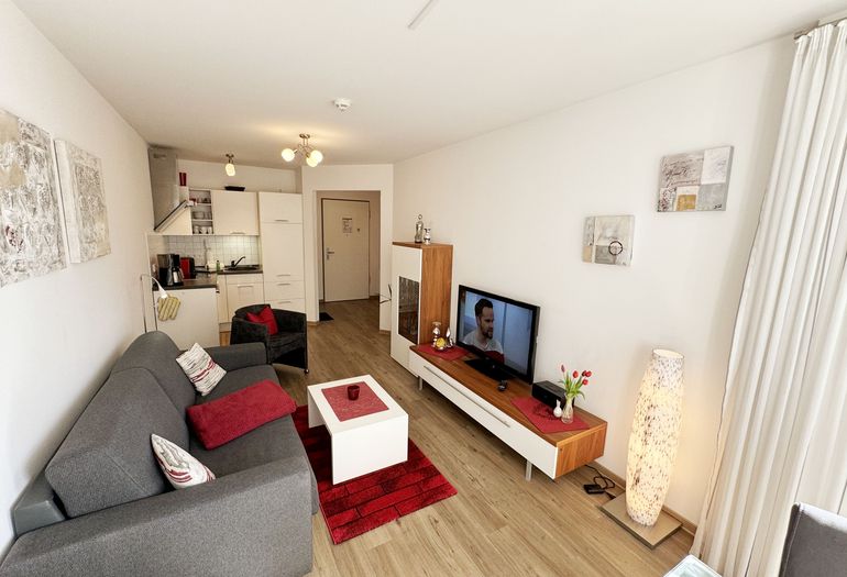 Wohnung Ostseesilber - Wohnzimmer mit Couch Wohnung Ostseesilber - Wohnzimmer mit Couch