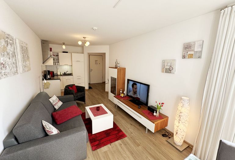 Wohnung Ostseesilber - Wohnzimmer mit Couch Wohnung Ostseesilber - Wohnzimmer mit Couch