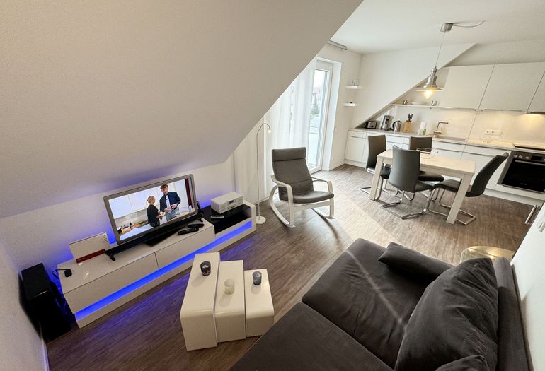 Flachbildschirm im Wohnbereich der Wohnung Flachbildschirm im Wohnbereich der Wohnung