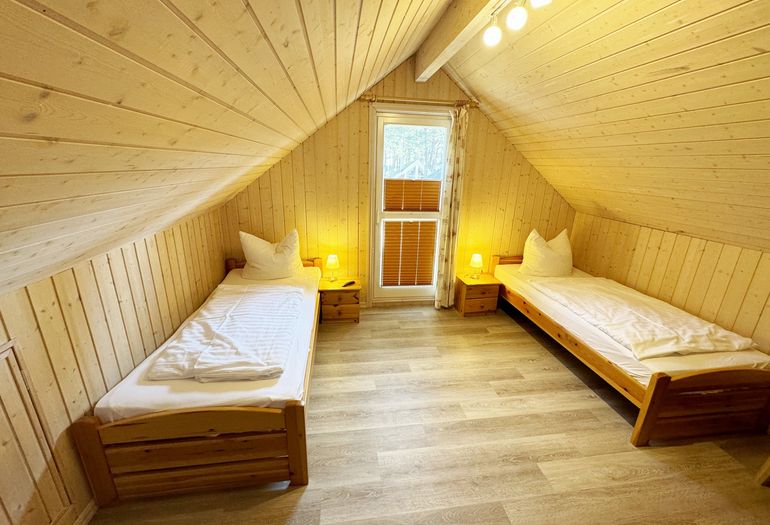 Ferienhaus Sprottenkiste - Schlafzimmer mit 2 Einelbetten Ferienhaus Sprottenkiste - Schlafzimmer mit 2 Einelbetten