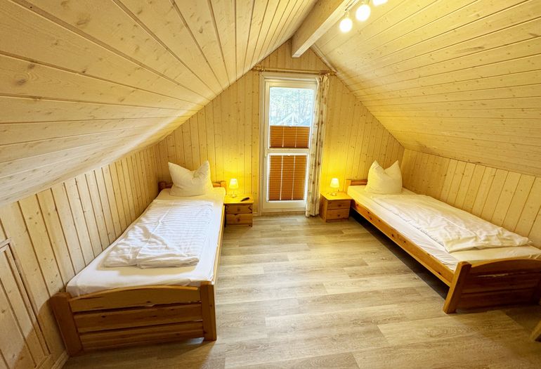 Ferienhaus Sprottenkiste - Schlafzimmer mit 2 Einelbetten