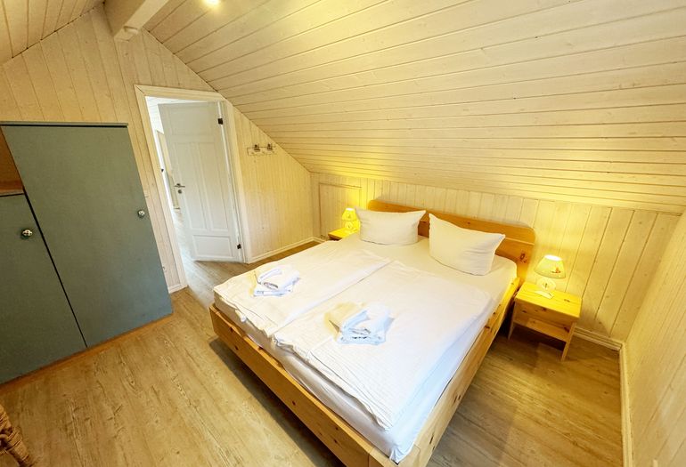 Ferienhaus Sandkörnchen - 2. Schlafzimmer mit Zugang zur offenen Galerie Ferienhaus Sandkörnchen - 2. Schlafzimmer mit Zugang zur offenen Galerie